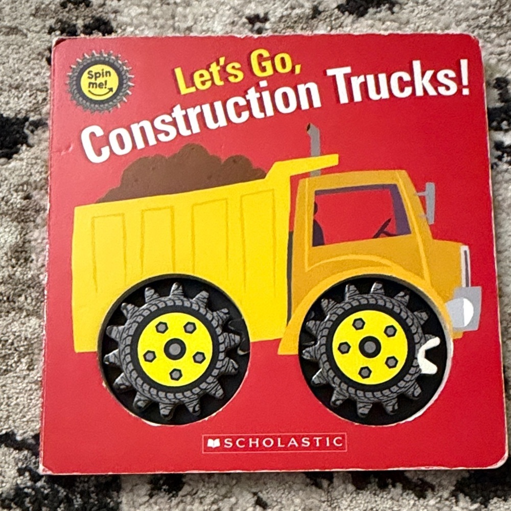 Scholastic Let's Go, Construction Trucks! Board Book - Yellow Truck on Red Cover